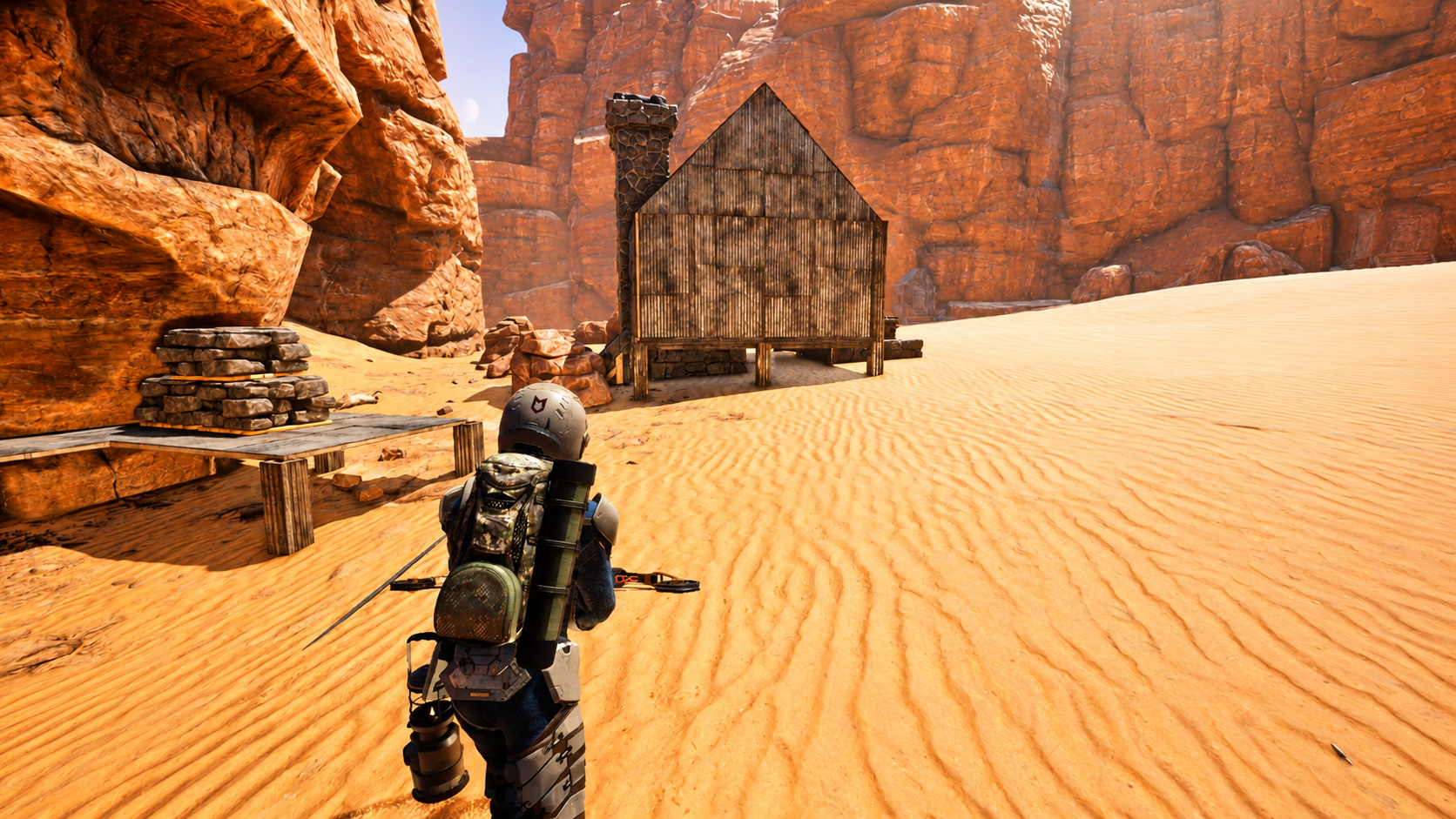 An Icarus prospector stands before a shelter among red desert cliffs